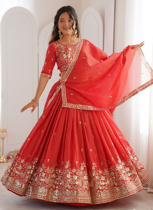 Customary Orange Heavy Embroidered Shimmer Silk Lehenga Choli For Women